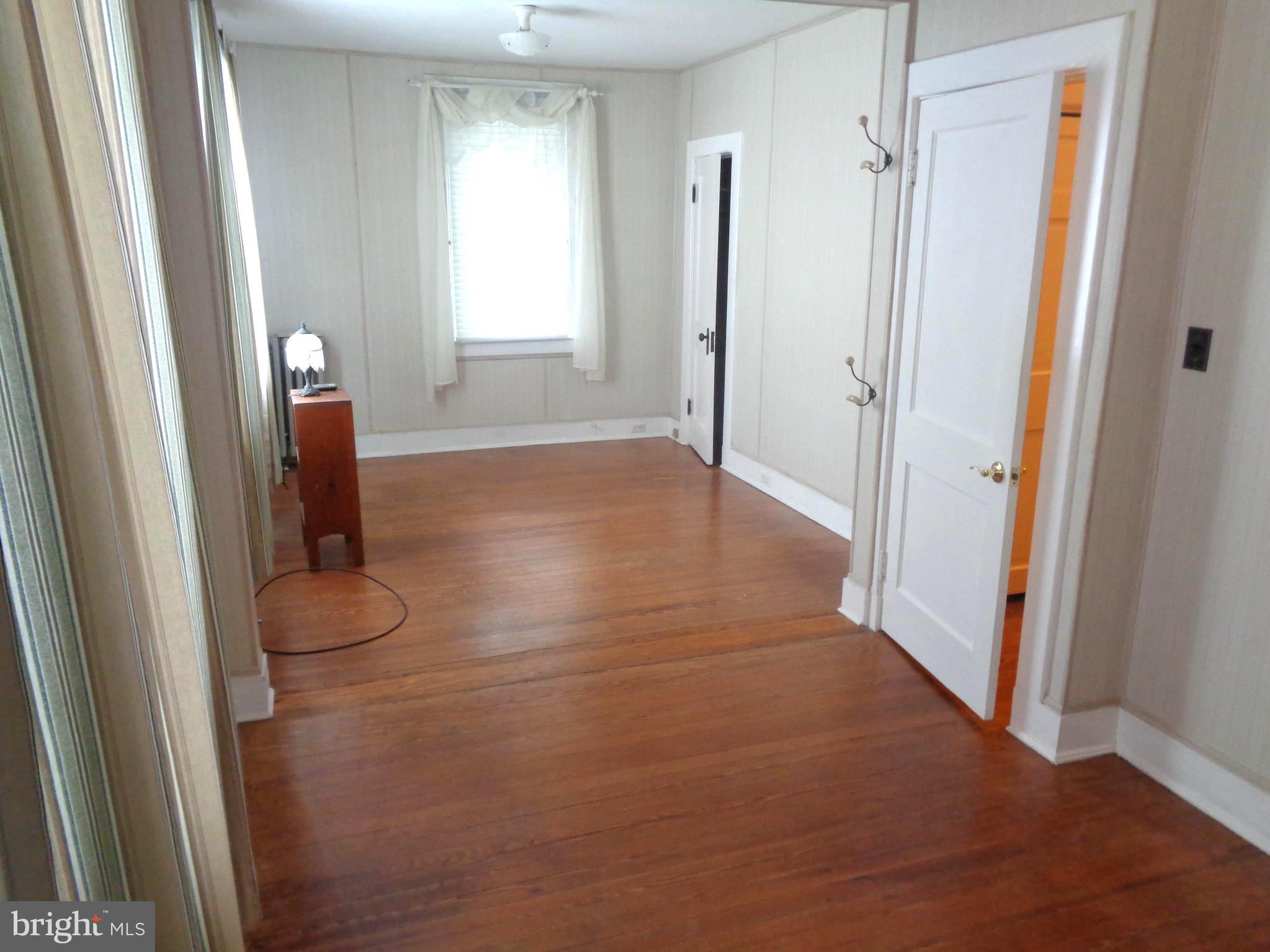47 Broadship Road Baltimore, MD 21222 - Photo 7 of 27 a view of entryway with window and hardwood floor
