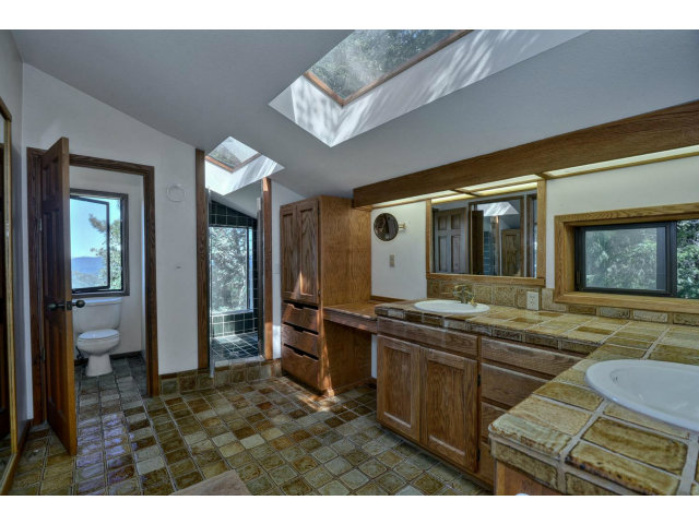 18554 Favre Ridge Road Los Gatos, CA 95033 - Photo 13 of 21 a living room with stainless steel appliances kitchen island granite countertop a sink and cabinets