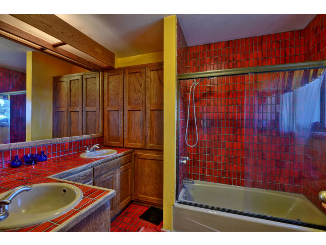 18554 Favre Ridge Road Los Gatos, CA 95033 - Photo 16 of 21 a bathroom with a sink and a mirror