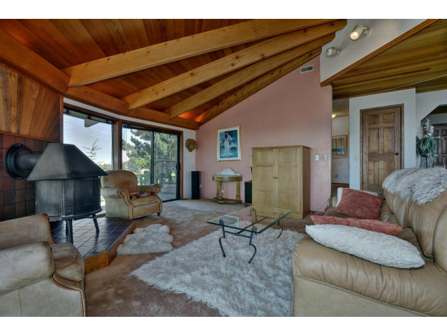18554 Favre Ridge Road Los Gatos, CA 95033 - Photo 5 of 21 a living room with furniture and a large window