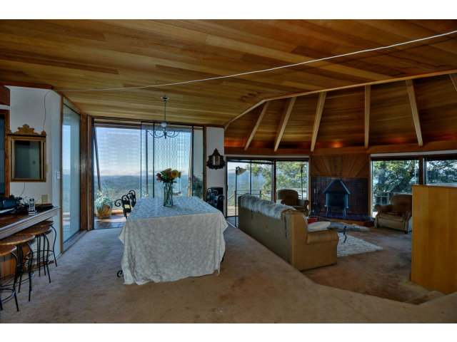 18554 Favre Ridge Road Los Gatos, CA 95033 - Photo 7 of 21 a living room with furniture a ceiling fan and a window