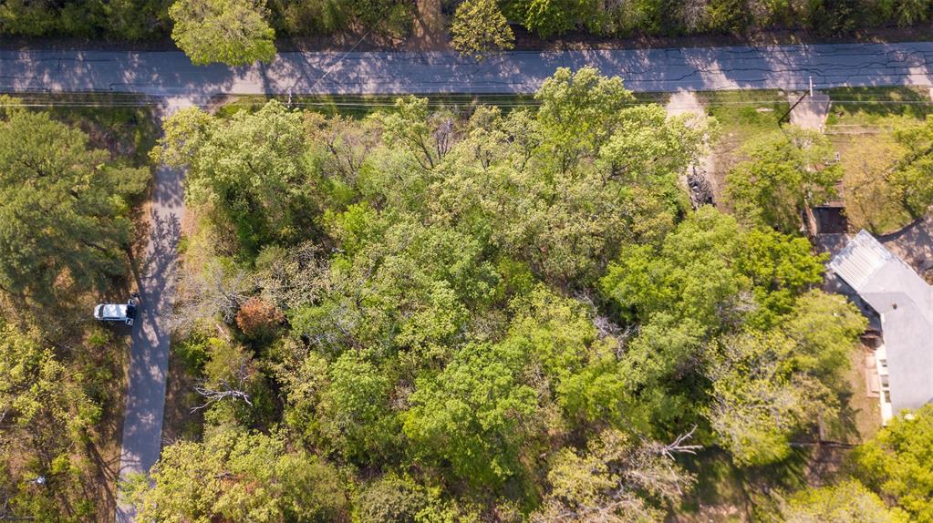 1366 Utopia Road Tool, TX 75143 - Photo 3 of 26 a view of a lake with a house in the background