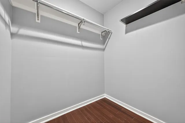 a view of a small space with wooden floor