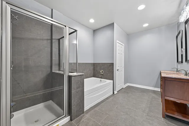 a bathroom with a tub and a shower