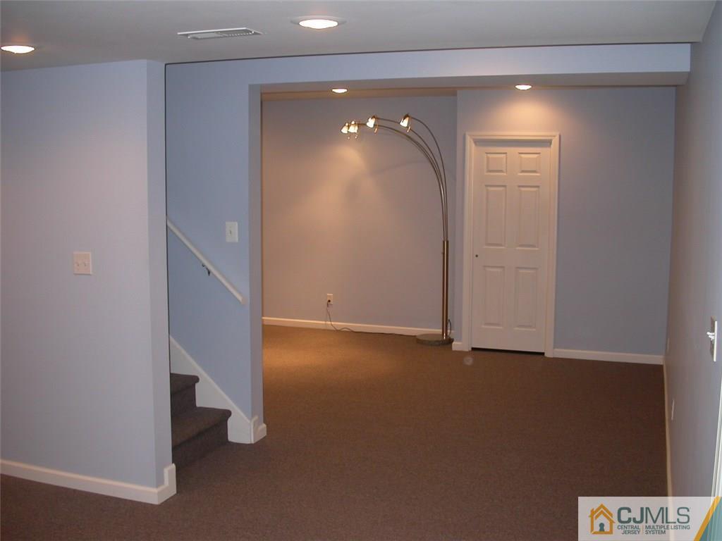 25 Maher Road Somerset, NJ 08873 - Photo 22 of 25 an empty room with windows and entrance