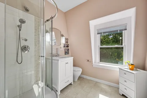 a bathroom with a tub and shower