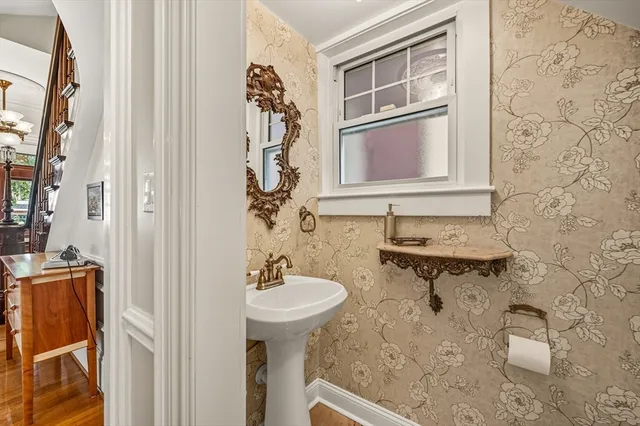 a bathroom with a sink a mirror and a shower