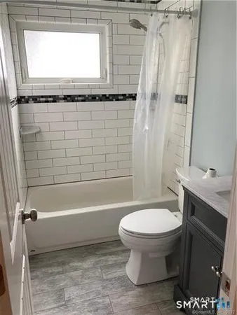 a bathroom with a sink a toilet and a bathtub