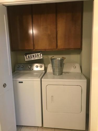 2708 McCart Avenue, Unit 2710 Fort Worth, TX 76110 - Photo 9 of 10 a utility room with dryer and washer