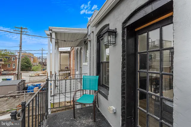a view of balcony with furniture