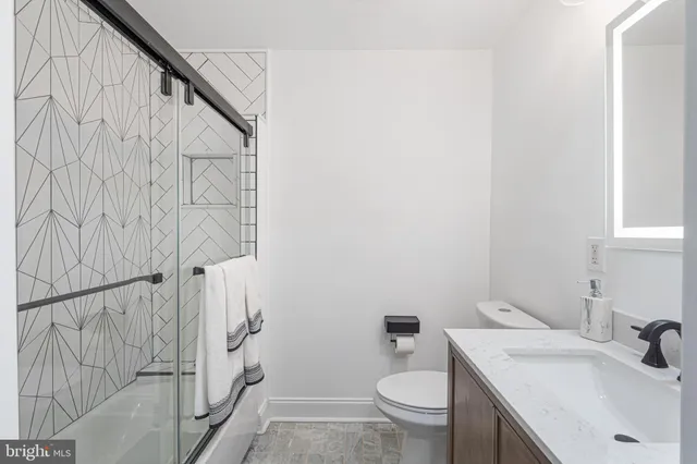 a bathroom with a sink and toilet