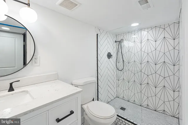 a bathroom with a toilet and a sink