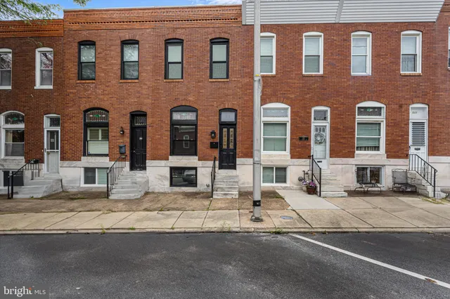a front view of a building with lot of windows