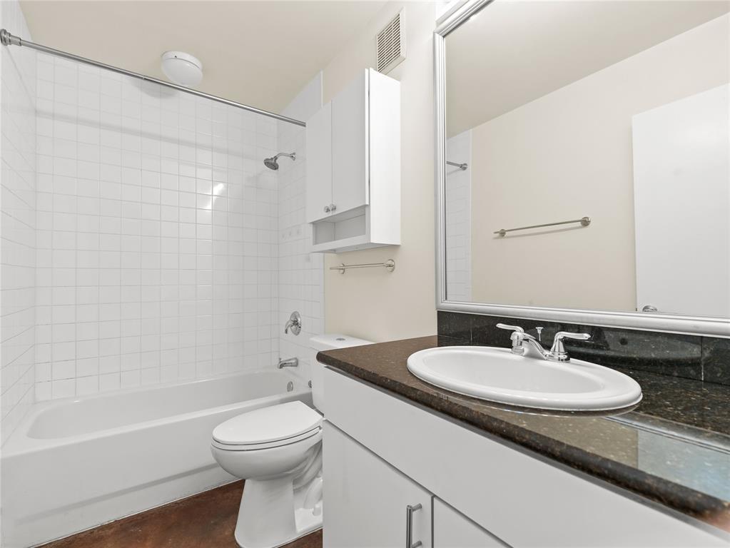 911 Keith Lane, Unit 12 Austin, TX 78705 - Photo 13 of 16 a bathroom with a sink toilet and shower