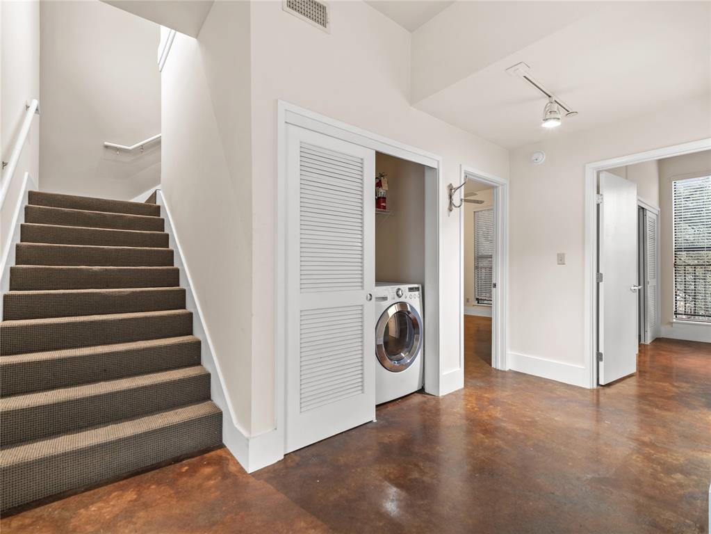 911 Keith Lane, Unit 12 Austin, TX 78705 - Photo 14 of 16 a view of a hallway with washer and dryer
