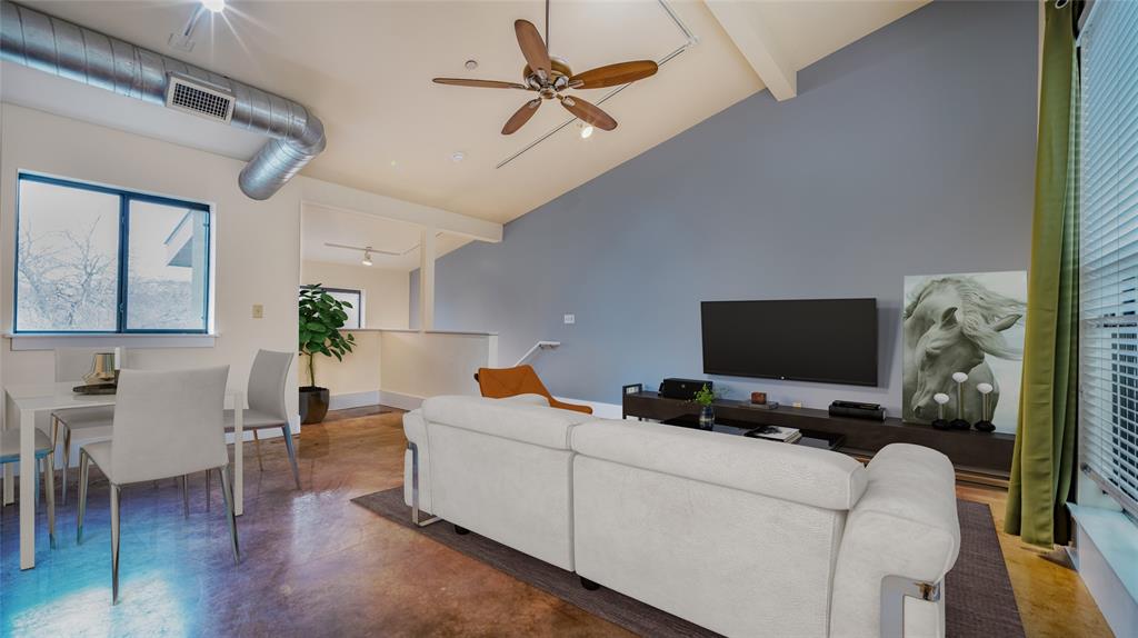 911 Keith Lane, Unit 12 Austin, TX 78705 - Photo 6 of 16 a living room with furniture and a flat screen tv