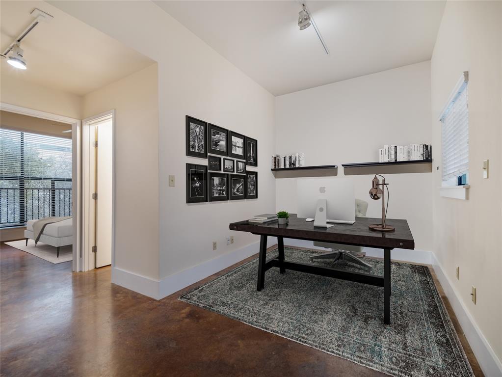 911 Keith Lane, Unit 12 Austin, TX 78705 - Photo 8 of 16 a view of a workspace with furniture and window