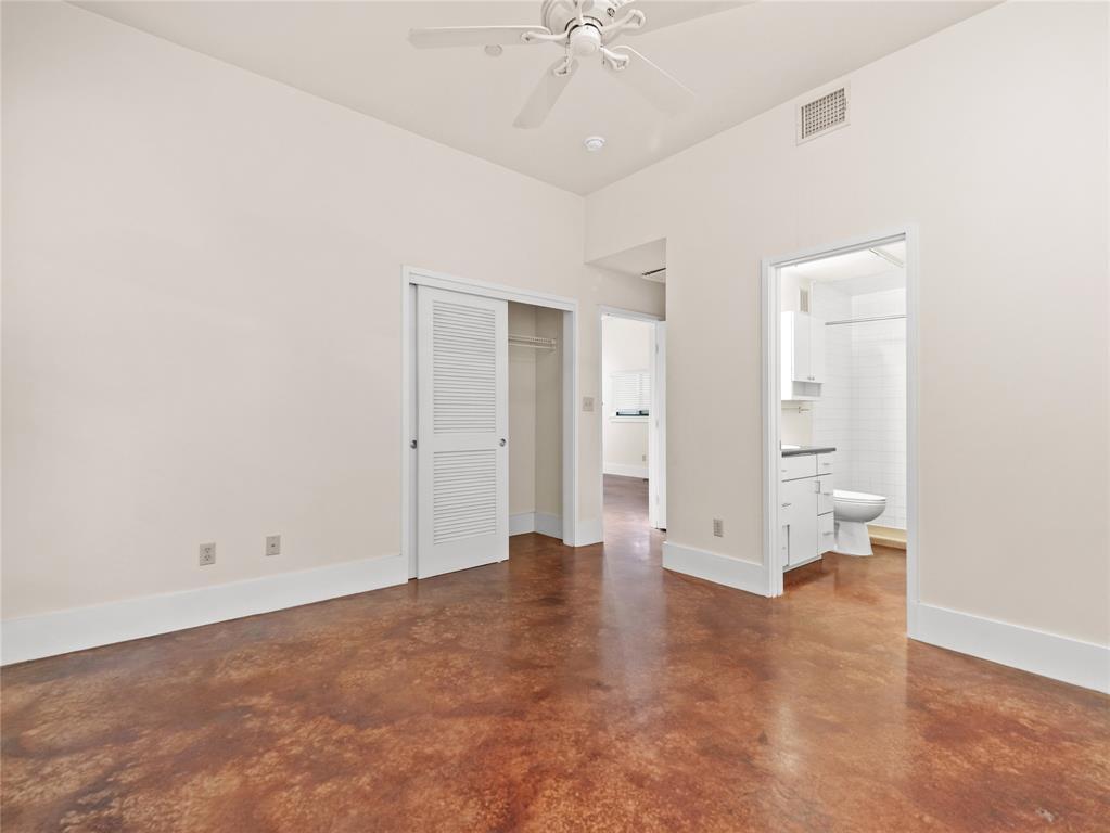 911 Keith Lane, Unit 12 Austin, TX 78705 - Photo 9 of 16 wooden floor in an empty room