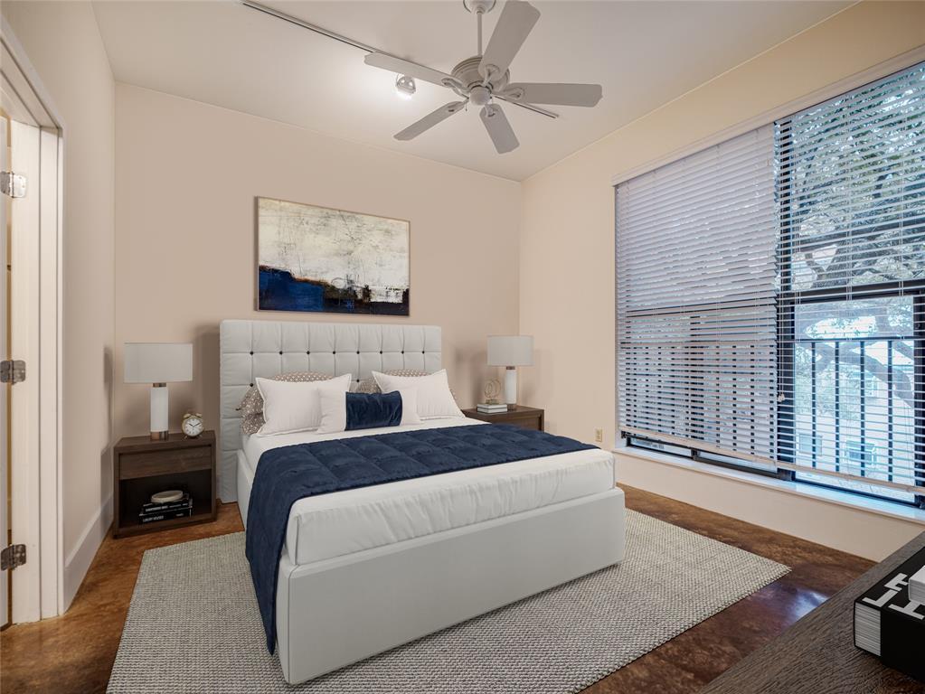 911 Keith Lane, Unit 12 Austin, TX 78705 - Photo 10 of 16 a bedroom with a large bed couch and a window