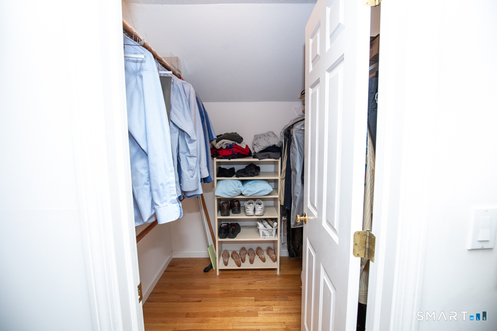 735 Cook Hill Road Cheshire, CT 06410 - Photo 22 of 35 One of two walk-in closets in primary bedroom.