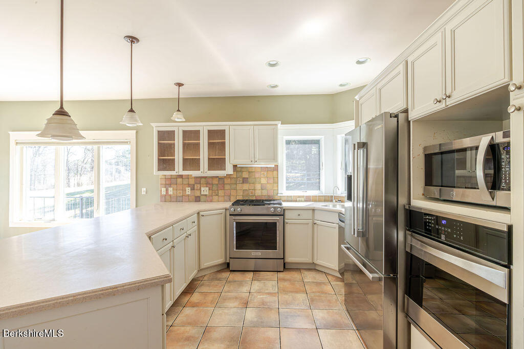 3 Townhouse Hill Road Egremont, MA 01230 - Photo 11 of 39 a kitchen with stainless steel appliances granite countertop a stove and a refrigerator