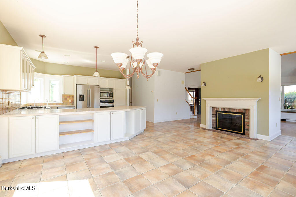 3 Townhouse Hill Road Egremont, MA 01230 - Photo 12 of 39 a view of a kitchen with a sink and a fireplace