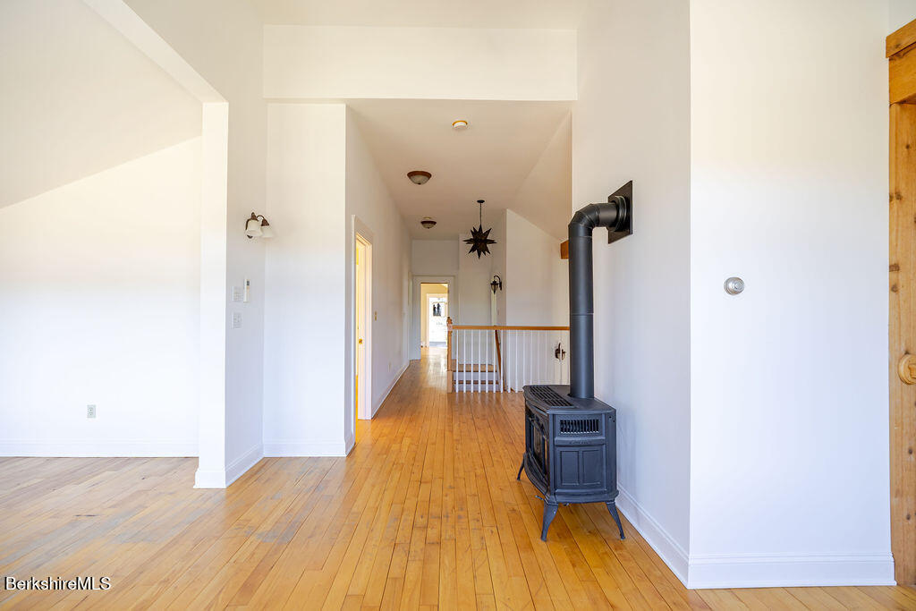 3 Townhouse Hill Road Egremont, MA 01230 - Photo 21 of 39 a view of a hallway with wooden floor and a bathroom