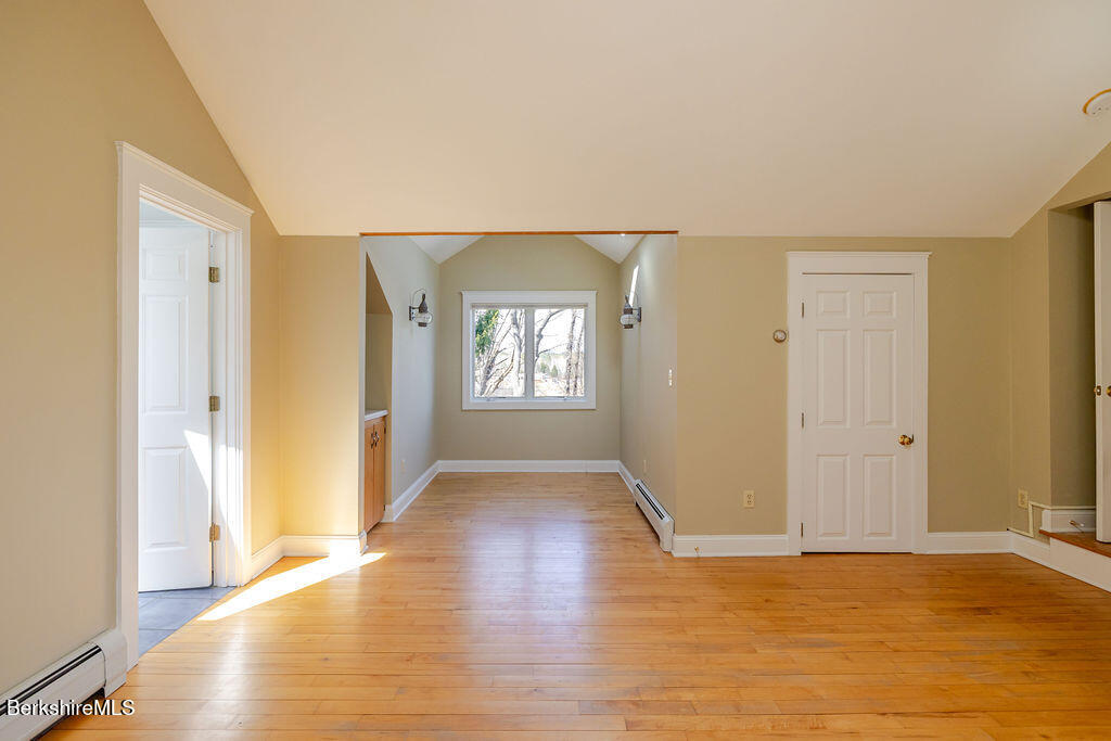 3 Townhouse Hill Road Egremont, MA 01230 - Photo 23 of 39 a view of an empty room with window and wooden floor