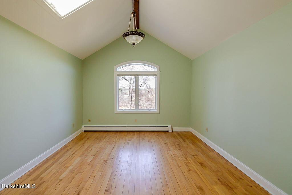3 Townhouse Hill Road Egremont, MA 01230 - Photo 26 of 39 an empty room with wooden floor fan and windows