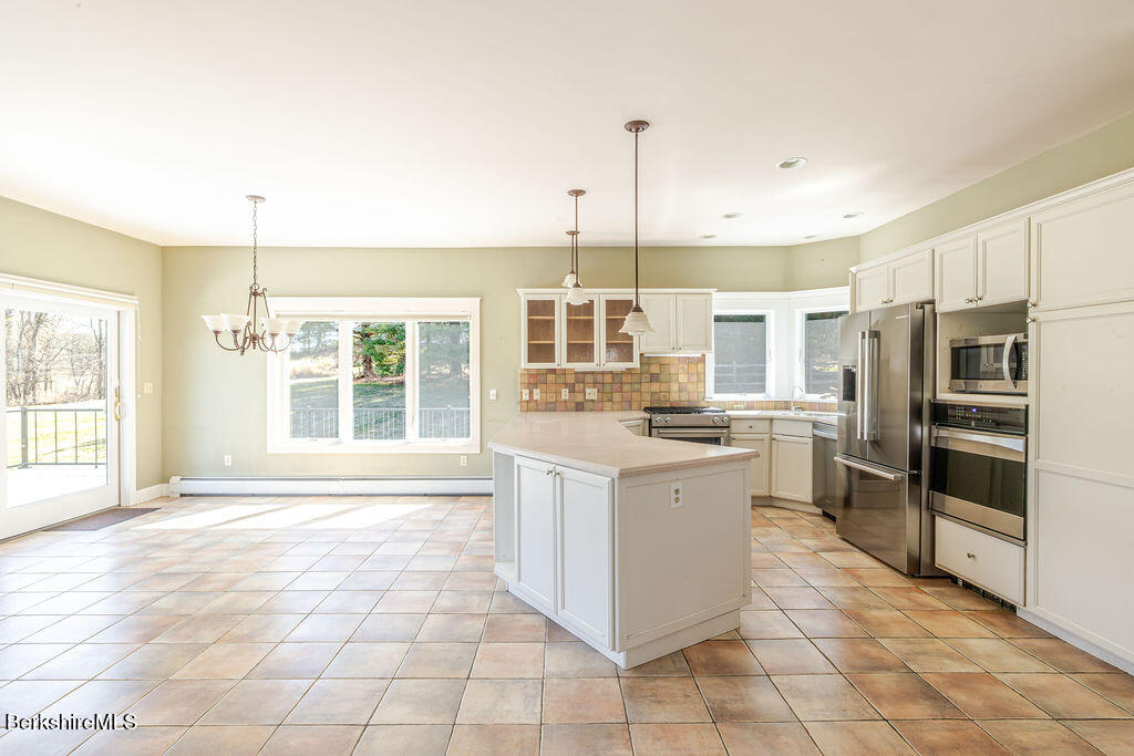 3 Townhouse Hill Road Egremont, MA 01230 - Photo 9 of 39 a kitchen with a stove a sink and a refrigerator