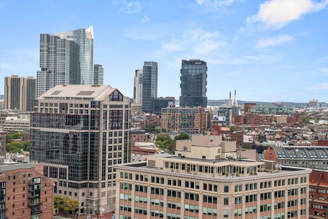 a view of a city with tall buildings