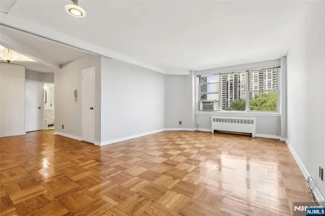 a view of an empty room with a window