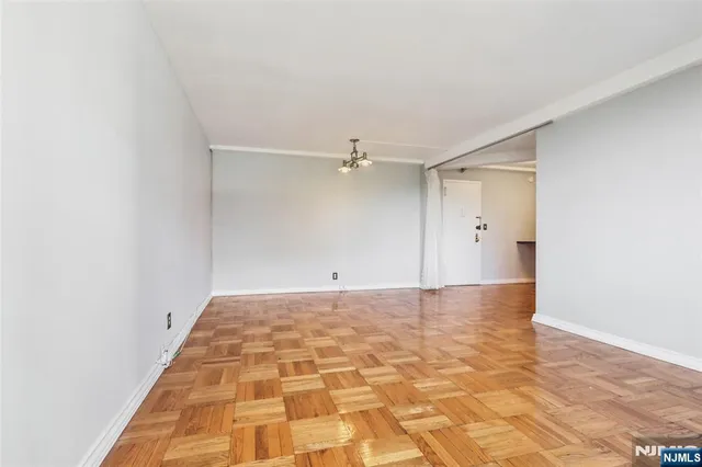 a kitchen with stainless steel appliances a refrigerator and a stove top oven