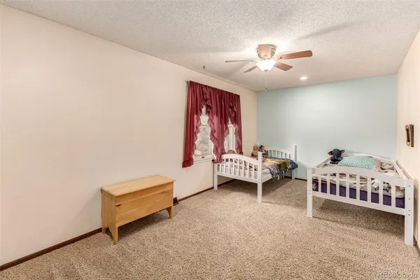 a bedroom with furniture and a window