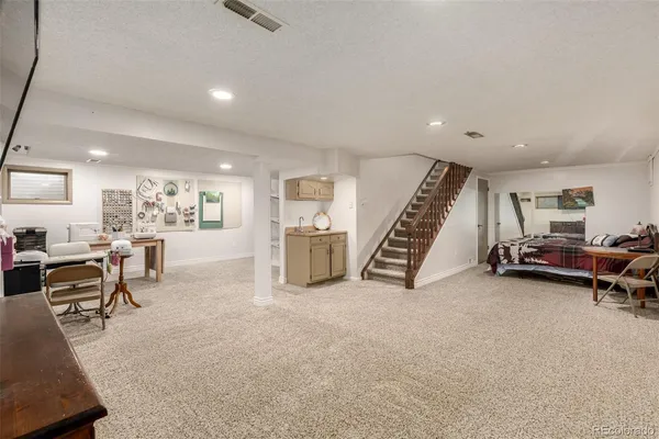 a view of a livingroom with furniture and a rug