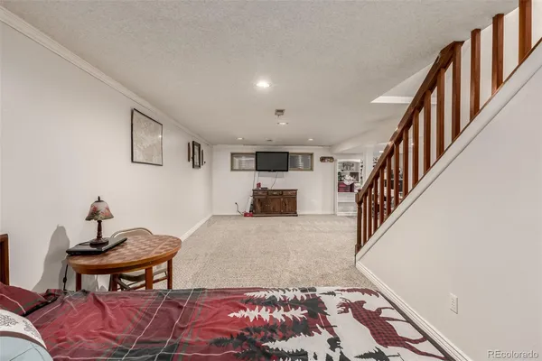 a living room with furniture and a rug