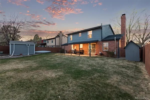 a view of a house with a back yard