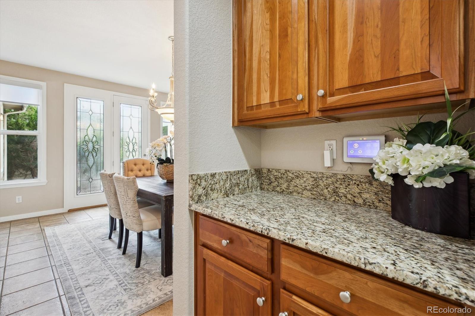 2601 Pemberly Avenue Highlands Ranch, CO 80126 - Photo 16 of 38 a kitchen with stainless steel appliances granite countertop a sink and cabinets