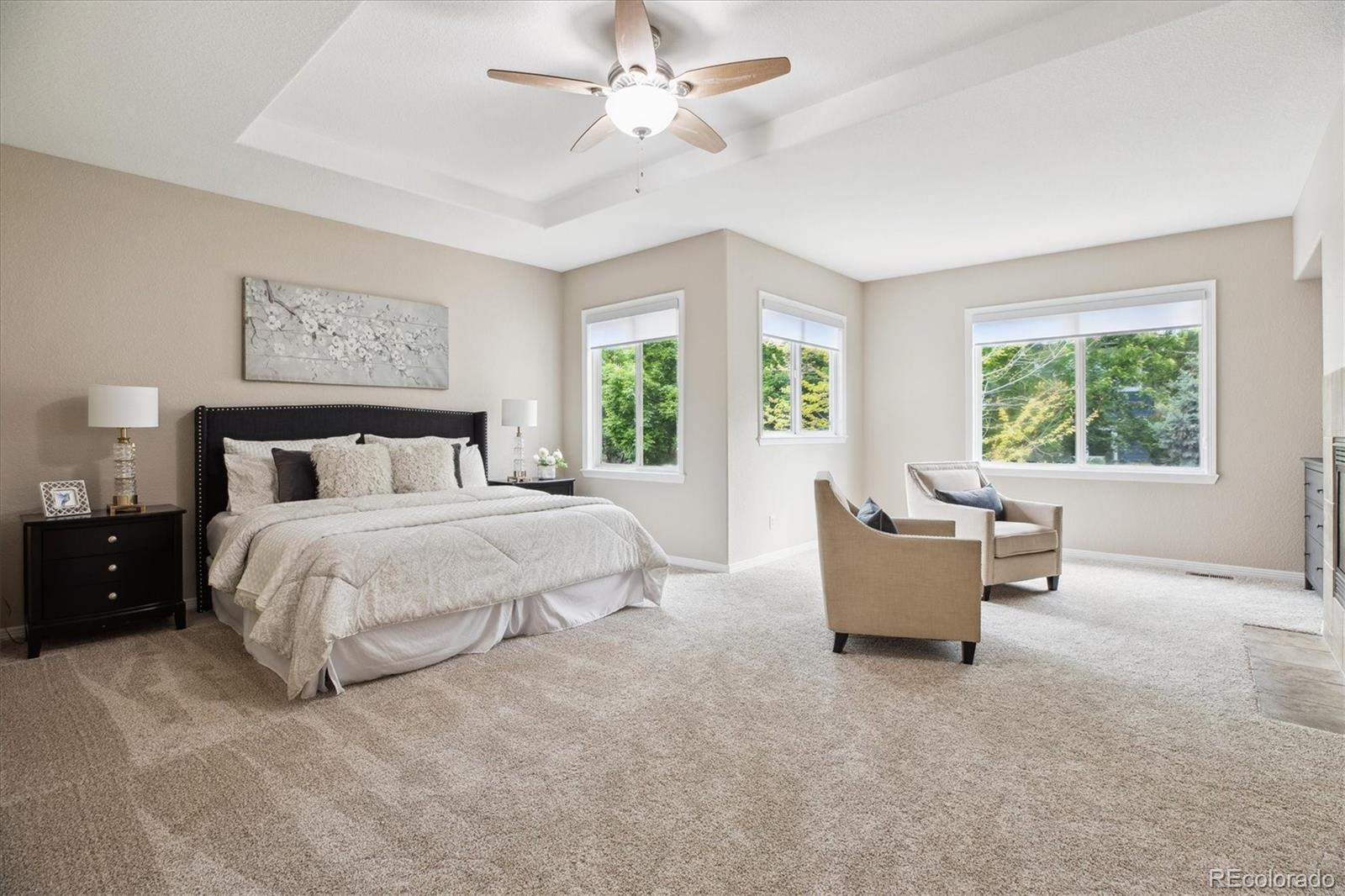 2601 Pemberly Avenue Highlands Ranch, CO 80126 - Photo 17 of 38 a bed room with a bed and a large window