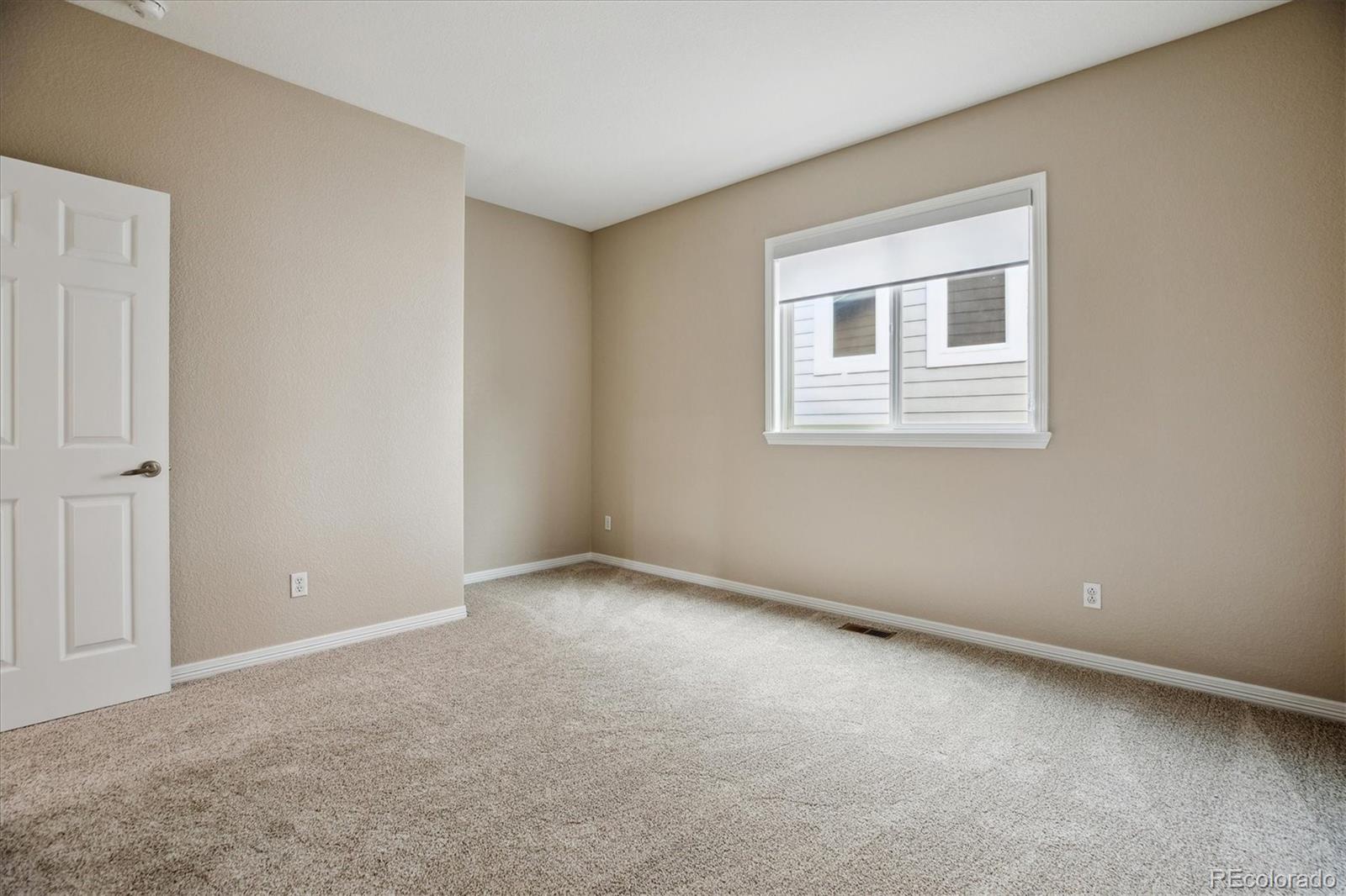 2601 Pemberly Avenue Highlands Ranch, CO 80126 - Photo 22 of 38 a view of an empty room with a window