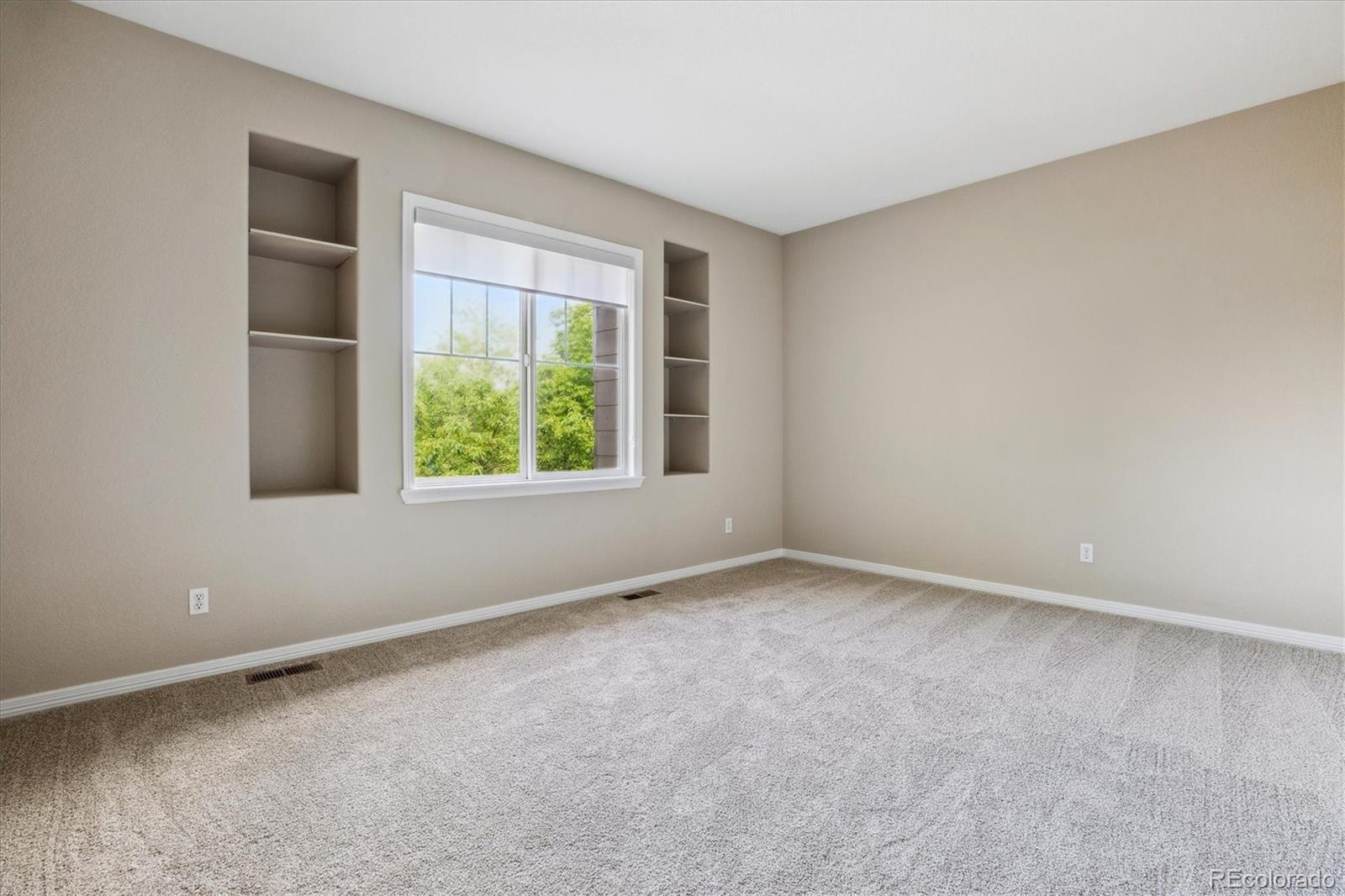2601 Pemberly Avenue Highlands Ranch, CO 80126 - Photo 23 of 38 an empty room with windows