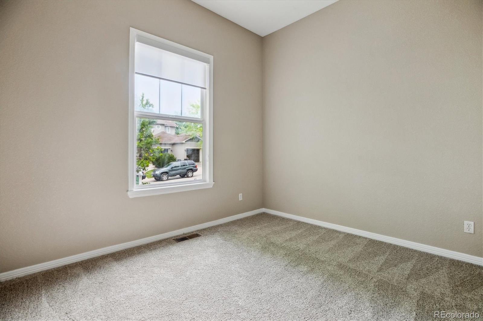 2601 Pemberly Avenue Highlands Ranch, CO 80126 - Photo 25 of 38 an empty room with a window