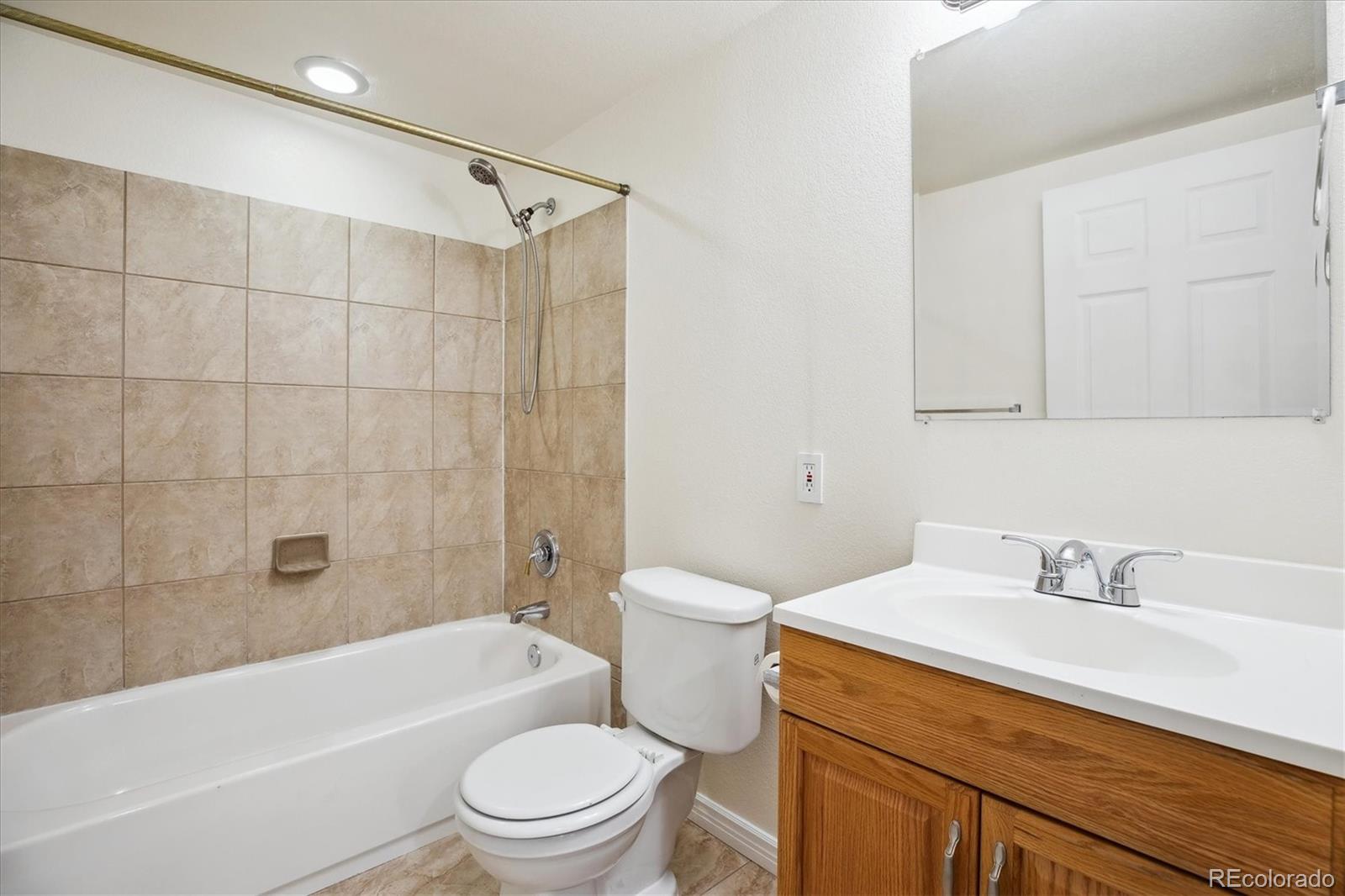 2601 Pemberly Avenue Highlands Ranch, CO 80126 - Photo 29 of 38 a bathroom with a sink a toilet and shower