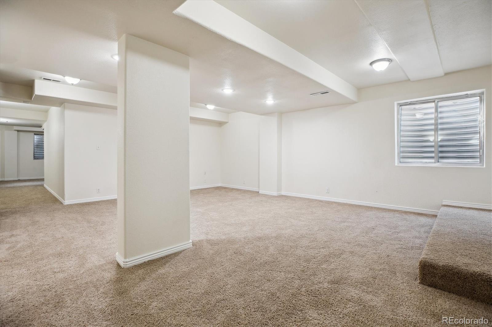 2601 Pemberly Avenue Highlands Ranch, CO 80126 - Photo 31 of 38 en empty room with windows