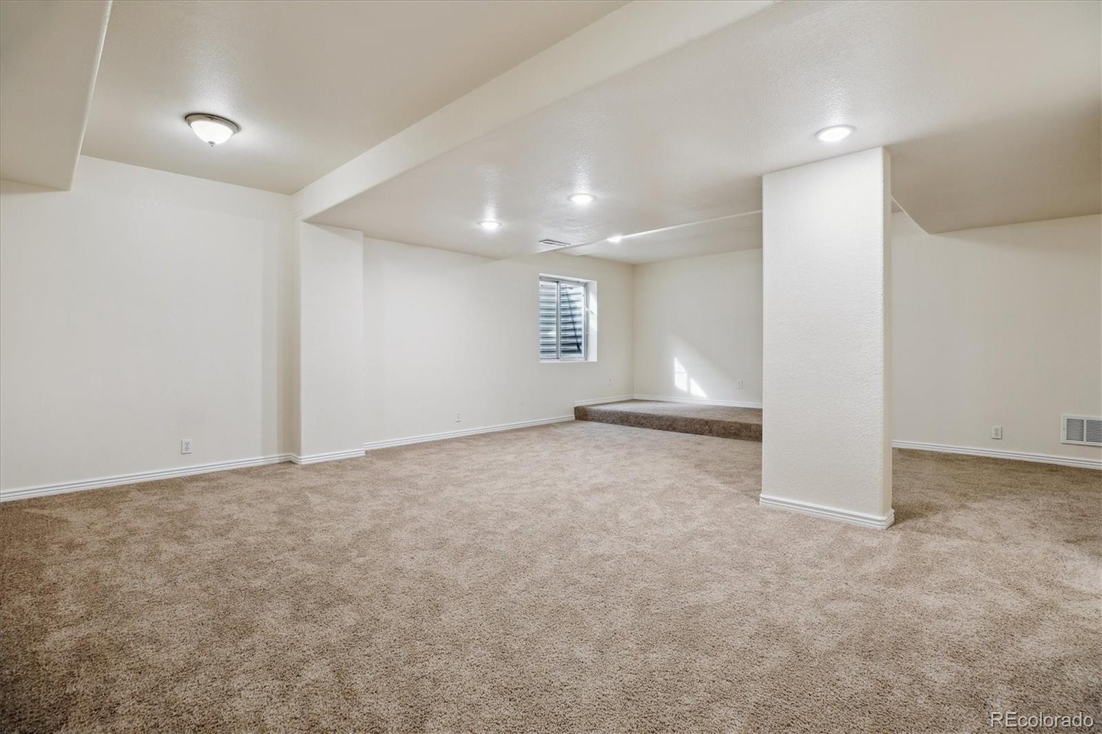 2601 Pemberly Avenue Highlands Ranch, CO 80126 - Photo 34 of 38 an empty room with windows