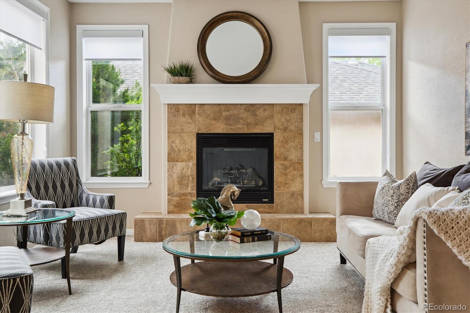 2601 Pemberly Avenue Highlands Ranch, CO 80126 - Photo 6 of 38 a living room with furniture a window and a fireplace