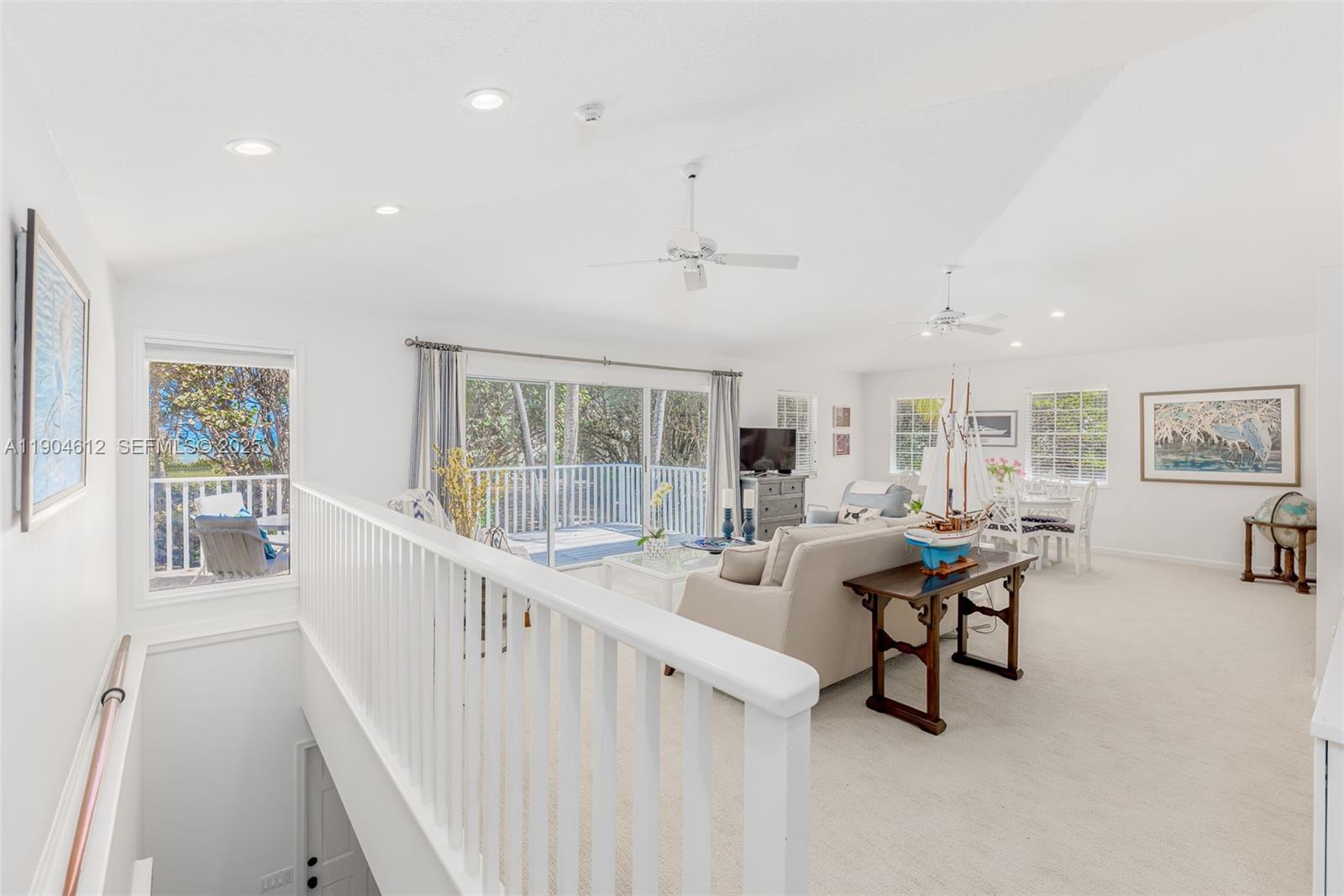 247 South Beach Road Jupiter Island, FL 33455 - Photo 16 of 71 a living room with furniture and a large window