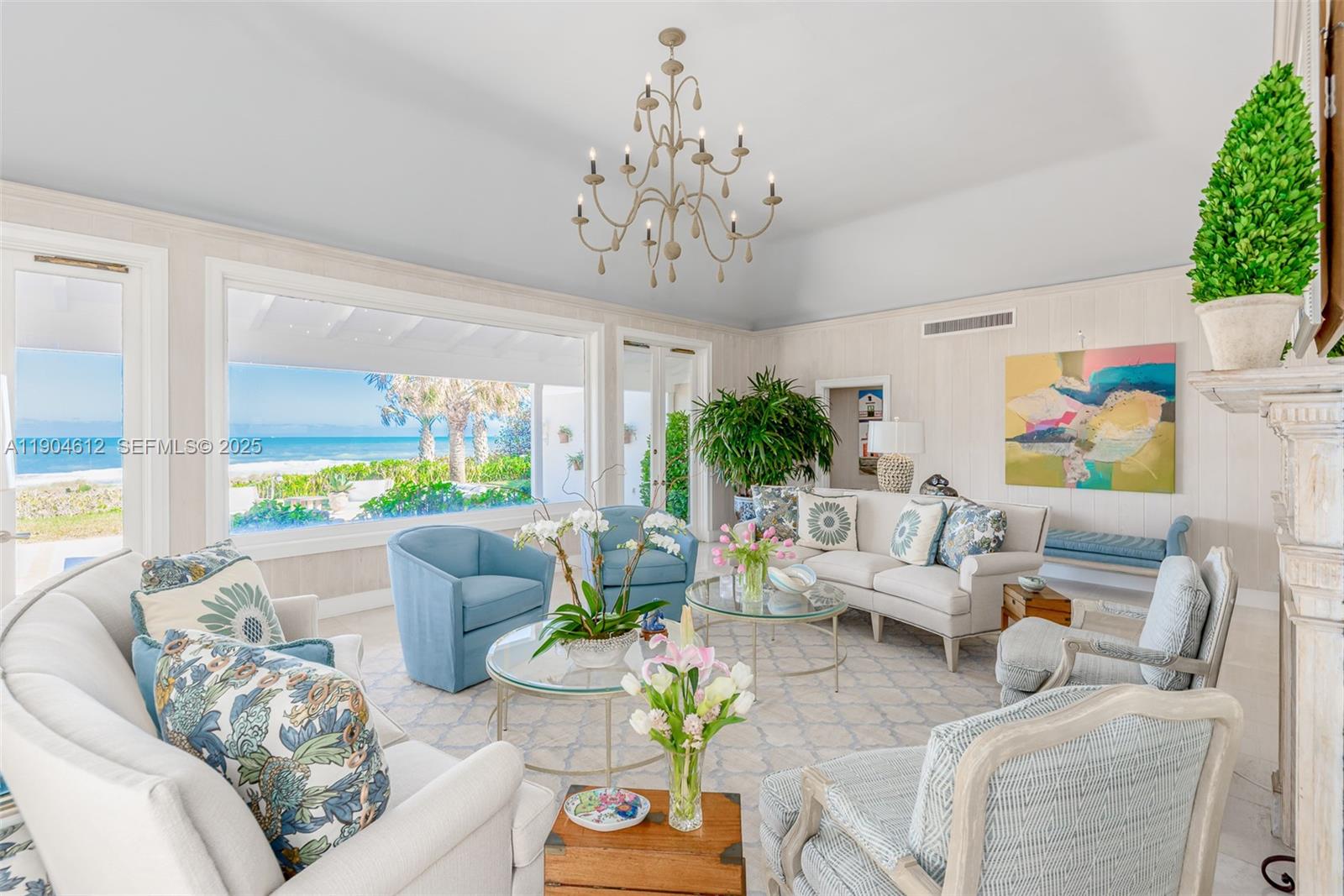 247 South Beach Road Jupiter Island, FL 33455 - Photo 33 of 71 a living room with furniture and a large window