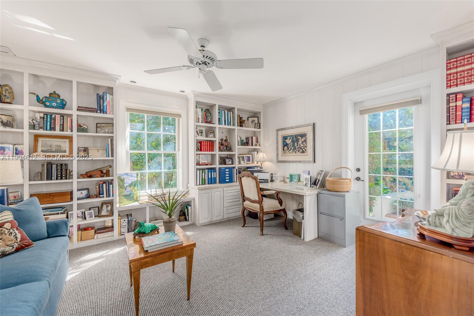 247 South Beach Road Jupiter Island, FL 33455 - Photo 43 of 71 a living room with furniture and a large window