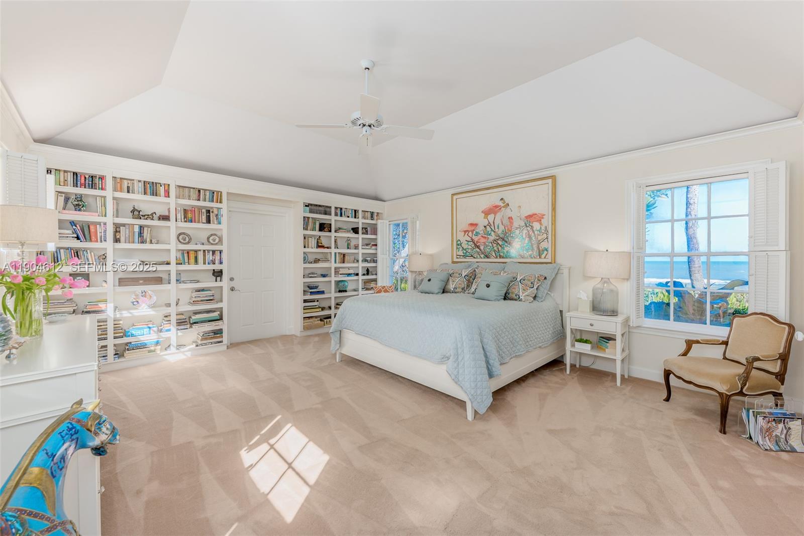 247 South Beach Road Jupiter Island, FL 33455 - Photo 45 of 71 a spacious bedroom with a bed and a large window